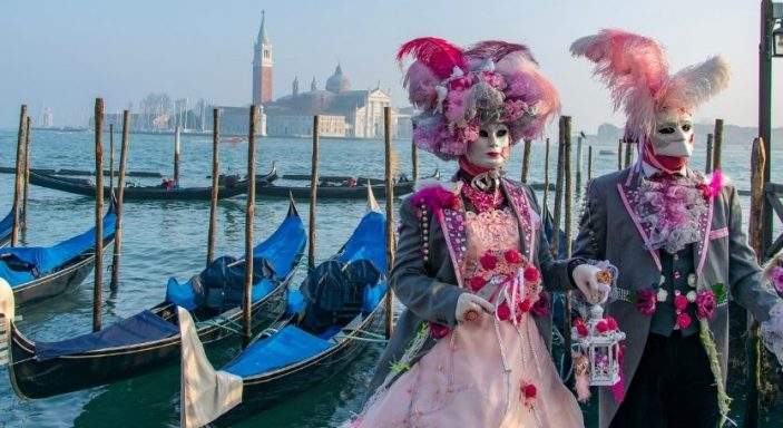 Carnival in Venice with costumes and gondolas