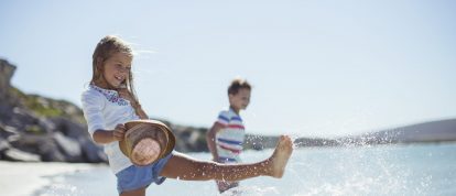 Two children playing on the beach in France in May