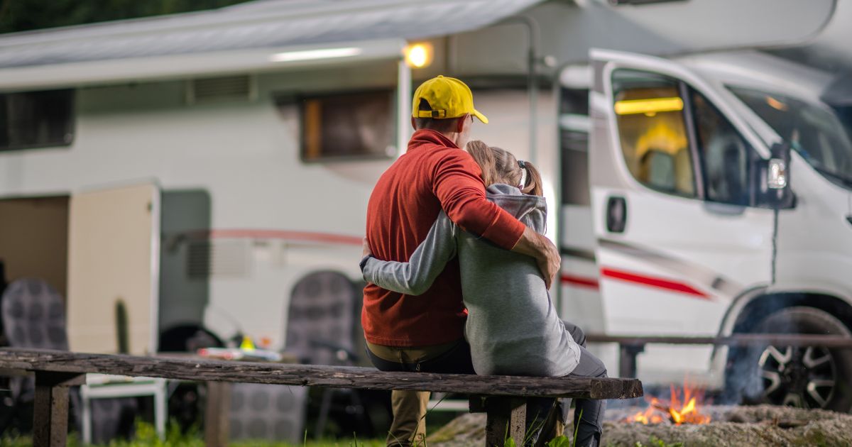 campervan holiday essentials - dad and daughter hug in front of their campervan