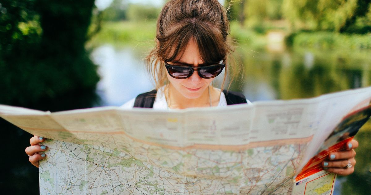 organising campervan trip - girl with map