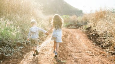 Boy and girl walking on a trail