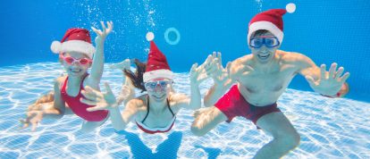 Family in pool on winter sun holiday