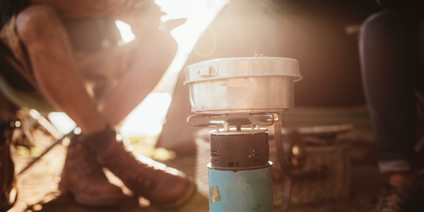 cooking on a camping stove. wild camping cooking