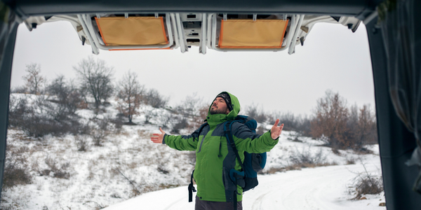 man in the snow on camping trip