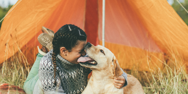 Camping tips - woman and dog camping