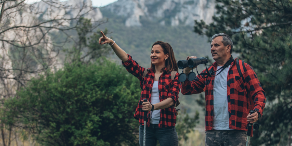 Dad and daughter on a hike in the mountains