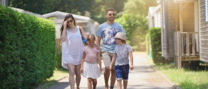A happy family walking together through a campsite in France - Campsites in Chamonix