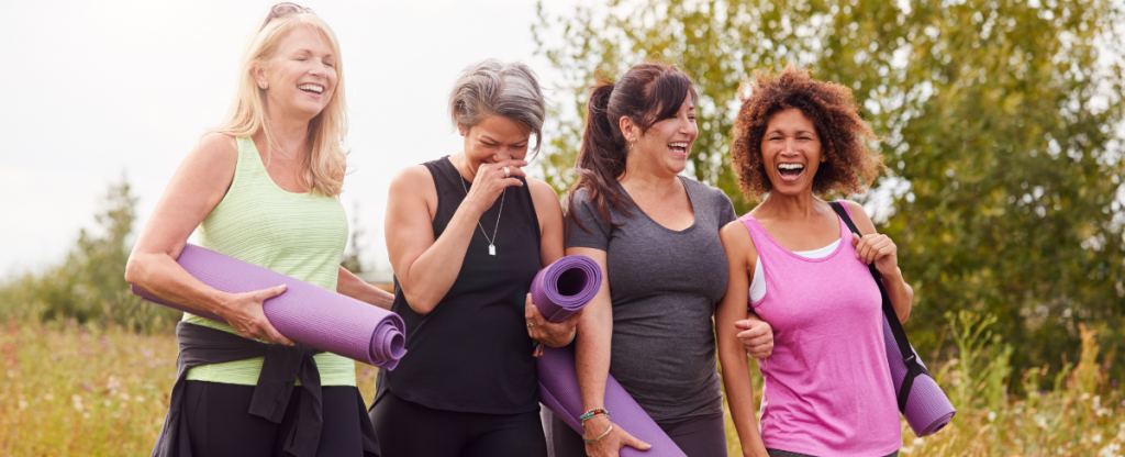 4 women enjoying yoga in the outdoors