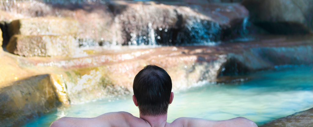 Man relaxing in a thermal bath in France 