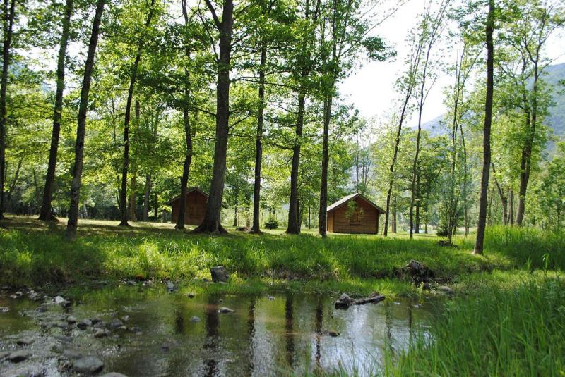 Au Valbonheur campsite. Wooden cabins in the woods