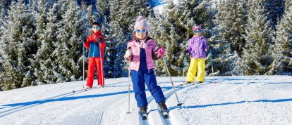 Children Cross-Country Skiing on a sunny day in the Alps at La Livraz, Nordic ski center in Megève - Campsites in Megève
