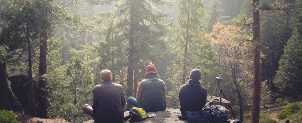 Group of men camping in the woodlands of Europe